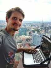me working from a rooftop bar in ho chi minh city on my personal travel blog