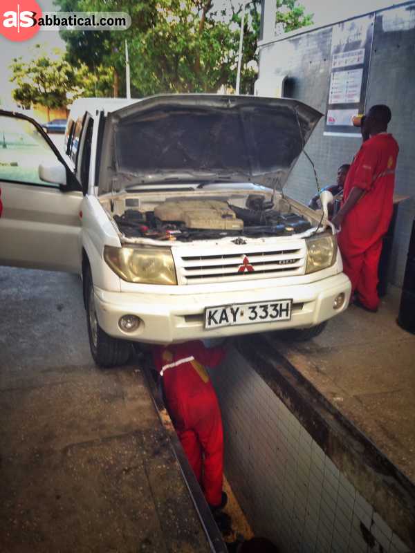 One of many bush mechanics trying to fix my car in Kenya