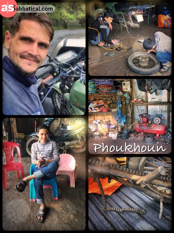 Mechanics in Phoukoun - pitstop in a small workshop to fix my broken Honda Win again