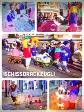 Schissdräckzügli - walking in a small group, mostly with children, along the carnival parade