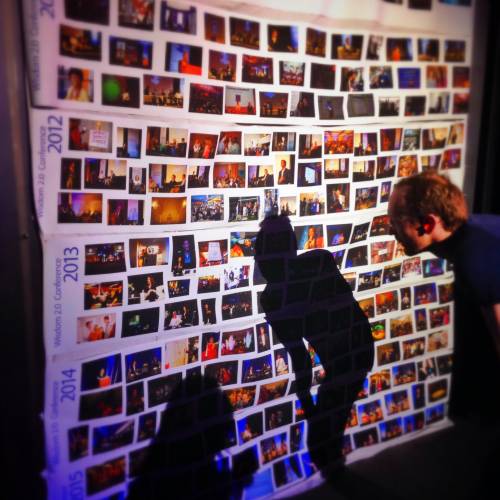 huge photo wall representing the usage of photo album maker for your travel memories