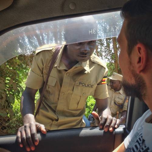 Friendly greeting a police officer on the border from Kenya to Uganda