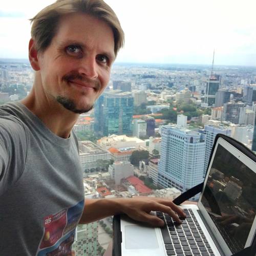 me working from a rooftop bar in ho chi minh city on my personal travel blog